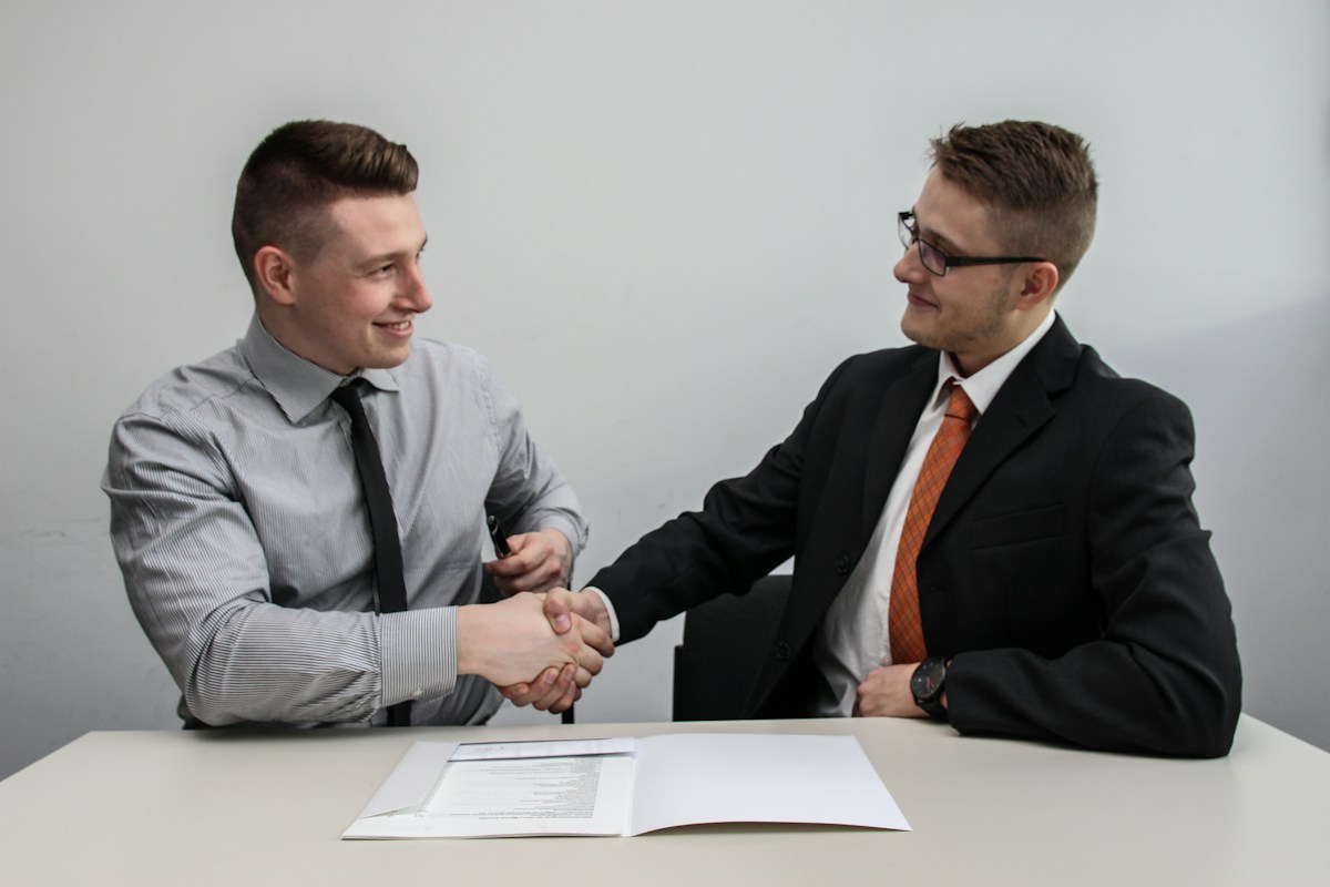 Professional multilingual call center team with smiling headset-wearing representative